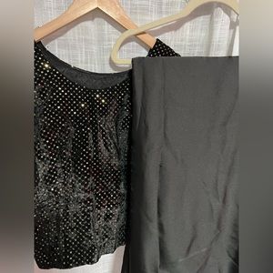 Elegant black saree with long velvet blouse.